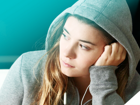 f8927f_70144c6a84274dcab5358f9580c84654~mv2 a woman with a hood on and hand on her face looking to the left