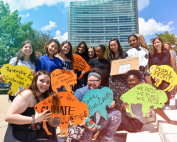 A group on generation z youth with signs