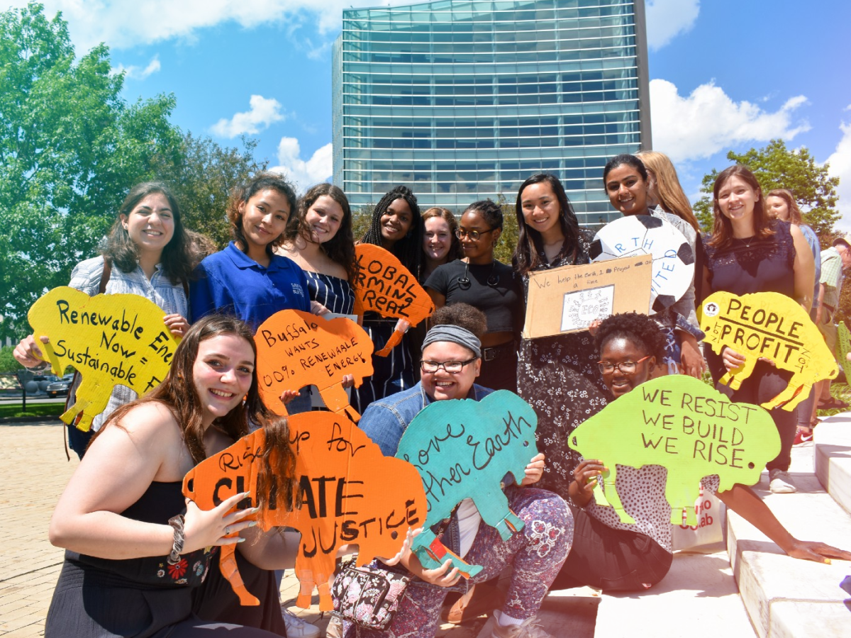 A group on generation z youth with signs