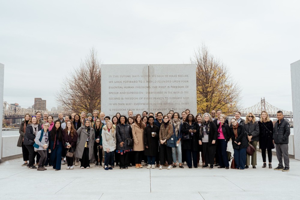 Jenn Hoos Rothberg and a group of people at four freedoms park
