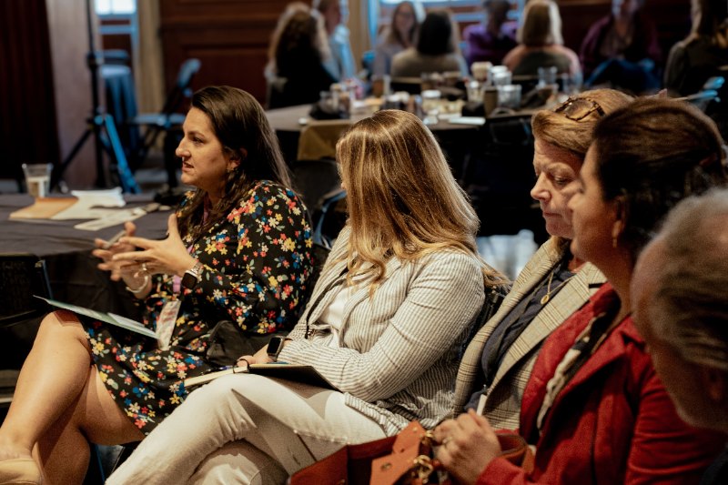 several women sitting in a row